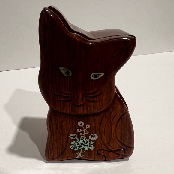 Handcrafted wood multi-stage jewelry box with red interior.